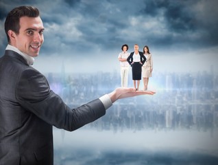 Wall Mural - Composite image of businessman holding business team