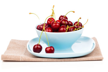 Bowl full of cherries isolated on white background