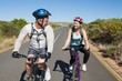 © WavebreakmediaMicro - Active couple going for a bike ride in the countryside