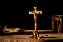 Catholic Cross On Altar In Church Lit By Sunlight