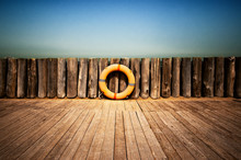 Lifebuoy On Wooden Wall