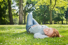 Woman Takes A Nap In A Park