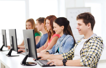 Canvas Print - male student with classmates in computer class