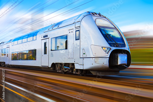 Cuadros en Lienzo Modern high speed train with motion blur