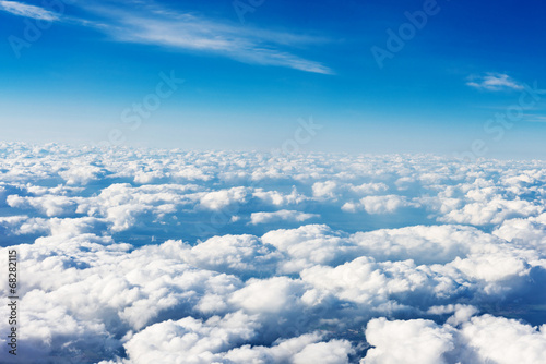 Naklejka - mata magnetyczna na lodówkę clouds. view from the window of an airplane flying in the clouds