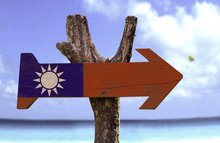 Taiwan Wooden Sign With A Beach On Background