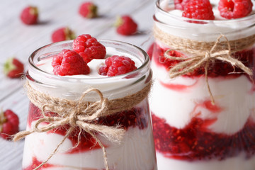 Fresh raspberry dessert in a glass jar closeup horizontal