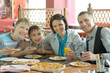 © aletia2011 - Smiling family eating pizza