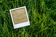 instant photo frame on the grass