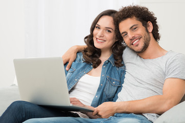 Wall Mural - Happy Couple Sitting On Couch