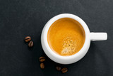 Fototapeta Mapy - espresso on a black background, top view