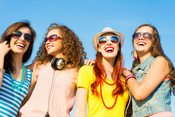 Wall Mural - group of young people wearing sunglasses and hat