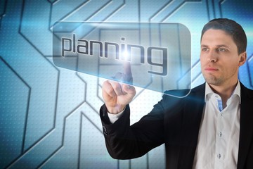 Aufkleber - Businessman pointing to word planning
