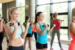 © Syda Productions - group of women with dumbbells in gym