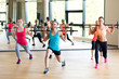 © Syda Productions - group of women with barbells in gym