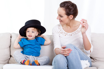 Wall Mural - Mother and child wearing hat