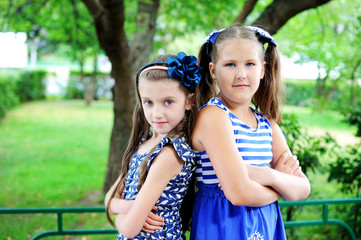 Portrait of two pretty school age girl friends