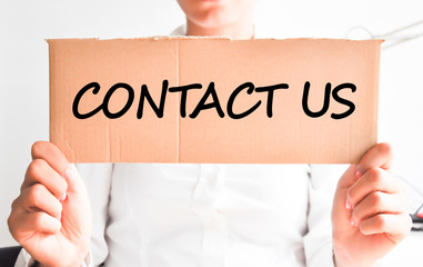 Contact us message on cardboard