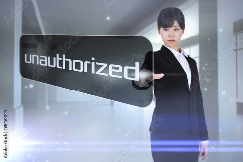 Fotografie, Obraz Businesswoman pointing to word unauthorized