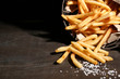 Tasty french fries in metal basket