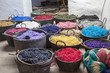 Pots with colorful yarns dyed in the old workshop