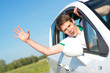© adam121 - man stuck his hand out of the window
