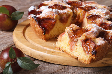 sliced ​​plum cake close up on chopping board horizontal