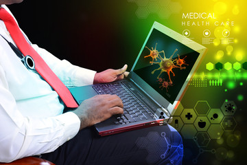 Wall Mural - Doctor with stethoscope and laptop