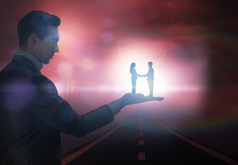 Poster - Composite image of businessman holding business partners