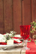 Christmas dining scene on rustic wood table and wall