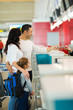 © michaeljung - family checking in at airline counter