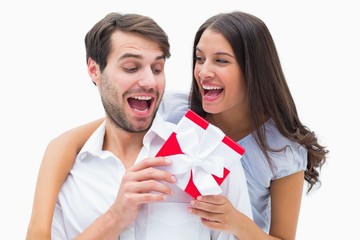 Poster - Pretty brunette surprising boyfriend with a gift