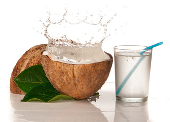 Wall Mural - coconut with water splash over white