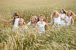 © zagorodnaya - portrait of little girls running on the field