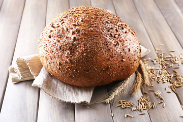 Fresh bread on wooden table, close up