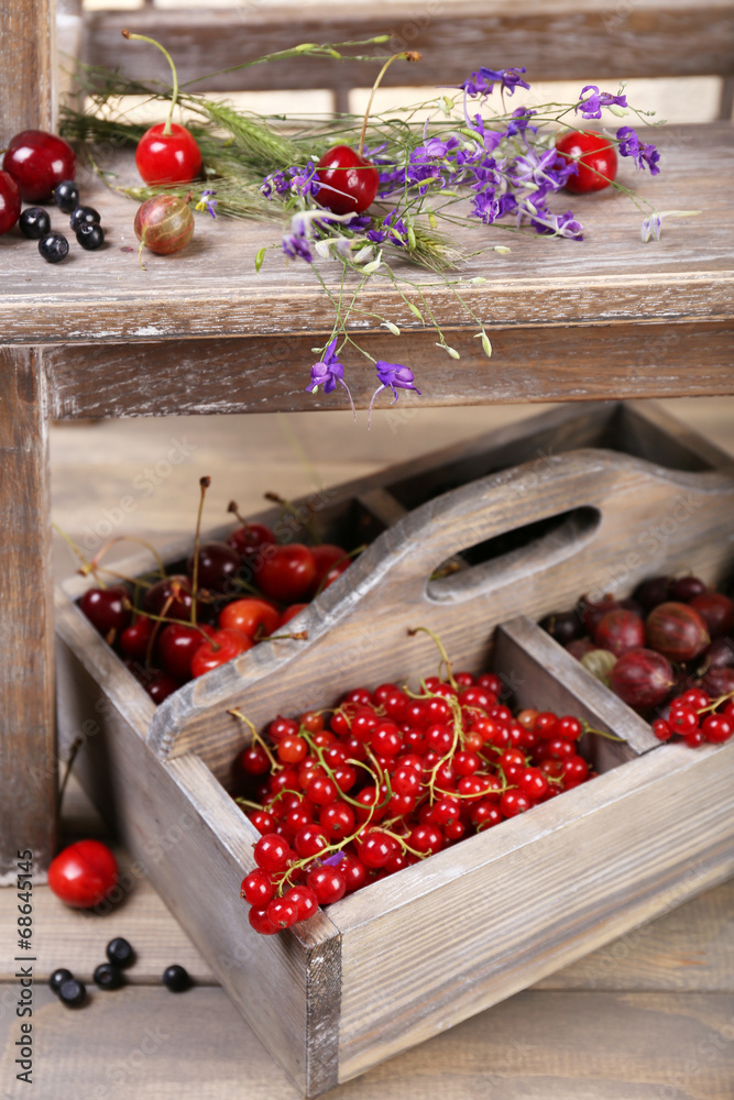 Fresh berries in wooden box, close up