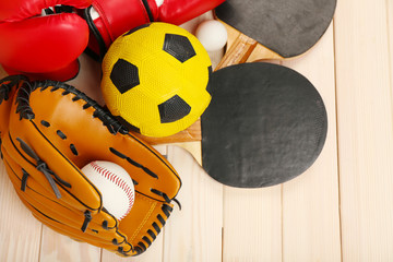 Wall Mural - Sports equipment on wooden background