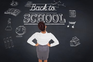 Poster - Composite image of businesswoman with hands on hips