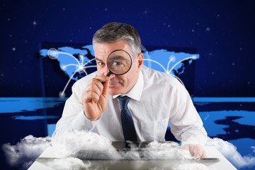 Poster - Composite image of mature businessman examining with magnifying