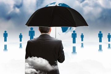 Poster - Composite image of mature businessman holding an umbrella