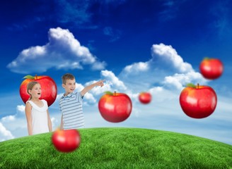 Poster - Composite image of young boy showing something to his sister