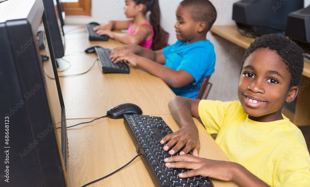 Cute pupils in computer class Stock Photo | Adobe Stock