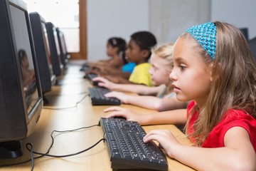 Wall Mural - Cute pupils in computer class