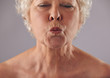 Senior woman puckering lips