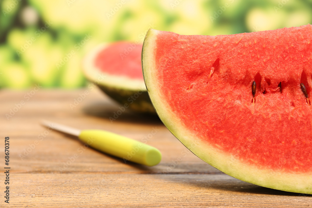 Fresh slice of watermelon on table outdoors, close up