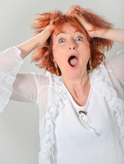 senior business woman arranging hair isolated over a white backg