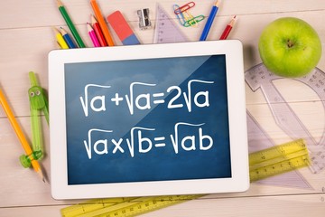 Poster - Composite image of digital tablet on students desk