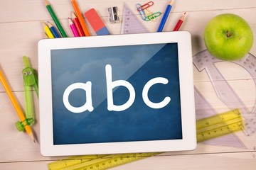 Poster - Composite image of digital tablet on students desk