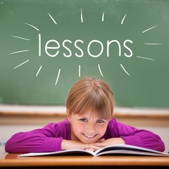 Lessons against cute pupil sitting at desk