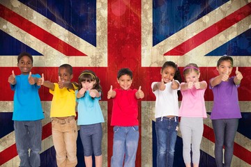 Poster - Composite image of elementary pupils smiling showing thumbs up